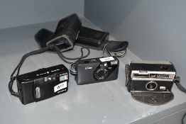 A Kodak Instamatic 110, a Konica U-Mini and an Olympus AF 10 Super cameras