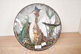 A mid 20th-century Pettits Feather Shop of Reedham, Norfolk feather art piece, of circular form,