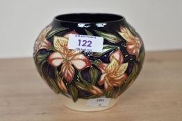 A small contemporary Moorcroft Pottery 'Peruvian Lily' vase, dated 2003 after Sian Leeper, featuring
