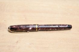 A Burnham B48 lever fill fountain pen in rose marble with single broad cap band having Burnham B48