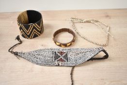 Of ethnographic interest, two pieces of 20th-century Papua New Guinea tribal shell adornment, to