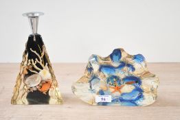 A mid to late 20th-century resin candle holder and decorative scene, featuring wet specimen