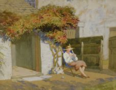 A 20th Century watercolour, depicting a woman knitting in a deck chair outside of a cottage,