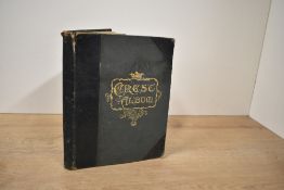 Curio. Album for Crests, Monograms, Coats of Arms, Postmarks, &c. London: E. Nister, no date. With