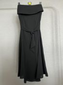 A 1970s vintage Parigi knee length skirt in black with butterfly hem and detachable fluted belt /