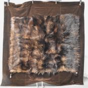 A 20th century vintage fur rug or blanket made from deep pile fur and soft brown velvet, has three