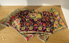 Three vintage Indian Choli cropped blouses, highly decorative with floral and foliate embroidery