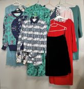 Assorted 1970s and 1980s vintage womens' wear in shades of teal and navy with red and pink