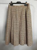A 1970s Aquascutum Made in England plaid and pleated knee length skirt in Pure New Wool camel with