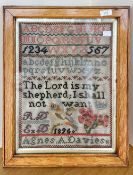 A 19th century framed and glazed needlework sampler, performed by Agnes A. Davies, 1896, depicts the
