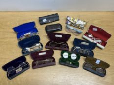 Assorted 19th century pairs of spectacles contained in glasses cases to include cat eye and wire