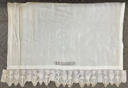 An antique white cotton altar cloth with filet crochet panels, one reads EPHPATHA (meaning 'be