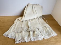 Five antique wool petticoats with embroidered cutwork edges, and lace under-layers.