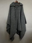 A vintage wool poncho style over shirt, in a thick and soft neppy blue herringbone tweed, with