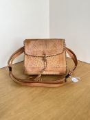 A 20th century vintage tootled leather shoulder bag, in smooth tan with black woven edging, measures