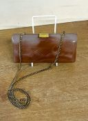 A vtinage structural statement clutch bag in blush pink marbled acrylic, with gold tone clasp