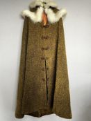 Two antique wool coats, comprising a light taupe swing coat having wide sleeves, gold double