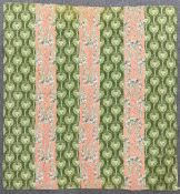 An antique Welsh quilt featuring unusual and rare fabrics, a green with celtic-style tree of life