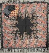 A Victorian paisley wool shawl having a jade, azure and red ornate design across a black ground with