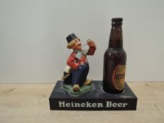 Heineken Beer Advertising Piece, Chalk Figure Dutch Boy with Pipe on plastic stand with a bottle