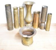 A mixed group of eight brass World War I & II trench art shell cases, one formed as a flared