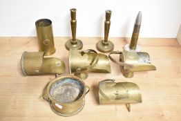 A selection of mixed World War I and II adapted brass trench art shell cases, including scuttles,