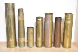 A group of seven British, French, German and American brass shell cases, pre-World war I, World