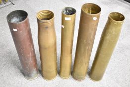 A group of five large brass shell cases, World War I and later, including 1975 practice shell