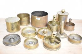 A selection of mixed World War I and later adapted brass trench art shell cases, ashtrays/nut