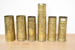 A group of six German, French and unidentified World War I brass trench art shell cases, including