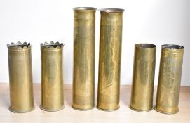 A near pair of unusual French brass 75DEC World War II trench art shell cases, decorated with