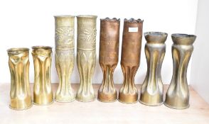 Four pairs of French, German and British world War I brass trench art shell cases, each with