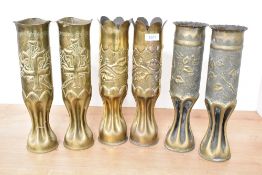 Three pairs of French World War I brass trench art shell cases, one pair with shaped rim and