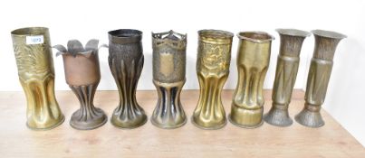 A group of eight German (and other) World War I brass trench art shell cases, to include a pair of