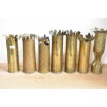 A Group of seven French and British brass World War I trench art shell cases, mainly 75DEC, each