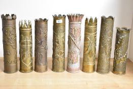 A group of eight French brass 75 DEC World War I trench art shell cases, some good examples with