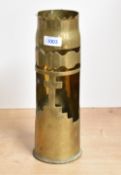 An interesting British World War I brass trench art shell case, with part lobed rim over a cut-out