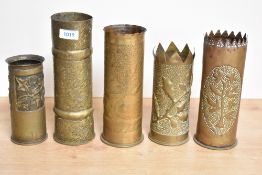 A group of five French and German World War I brass trench art shell cases, each with embossed and
