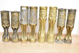 Four pairs of World War I brass trench art shell cases, three French 75DEC, one pair with baize