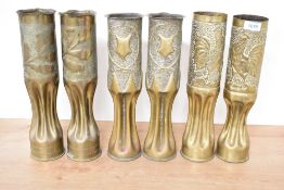 Three pairs of French World War I brass trench art shell cases, one pair with shaped rim and