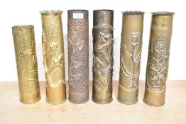 A group of six French and British World War I brass trench art shell cases, one stamped USA each