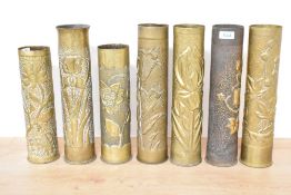 A group of seven World War I French brass trench art shell cases (one marked Remmington) each