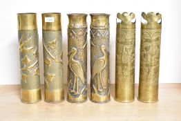 Three pairs of French brass 75DEC World War I trench art shell cases, each with embossed foliate