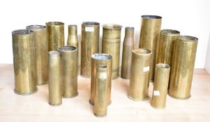 A section of World War I brass mixed calibre shell cases, mainly British and undecorated (16)