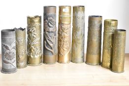 A group of nine British, German and French world War I brass trench art shell cases, each with