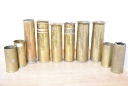 A group of ten British, French and German World War I brass trench art shell cases, tallest 31cm