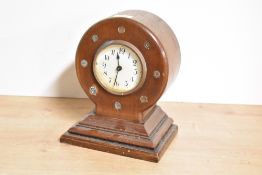 A World War I propeller boss mantel clock, of balloon form with Arabic hours to the dial, all raised