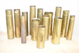 A mixed selection of World War I & II brass shell cases, undecorated and sold along with flak shells