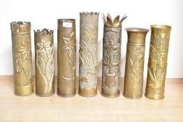 A group of seven World War I French brass 75DEC trench art shell cases, each with embossed and