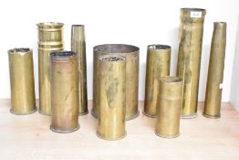 A mixed group of World War I & II Frencg, German and British brass shell casings, mostly unworked,
